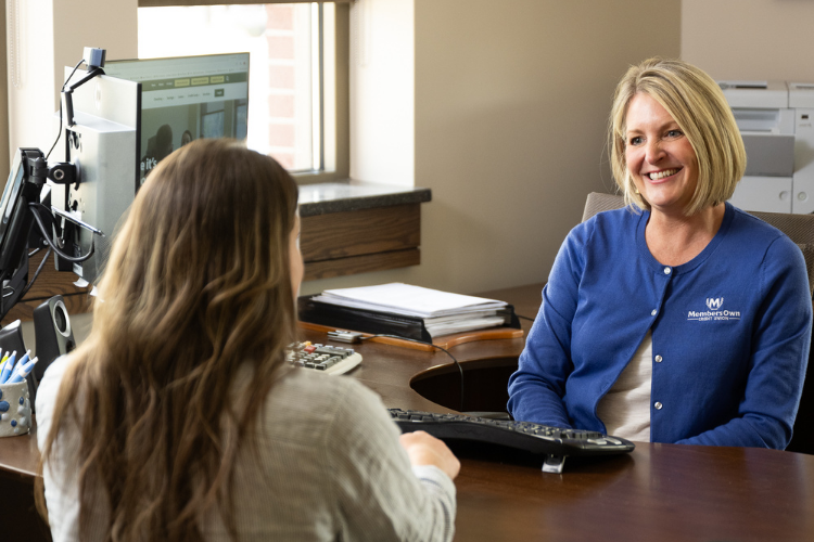 VP of lending smiling with a member