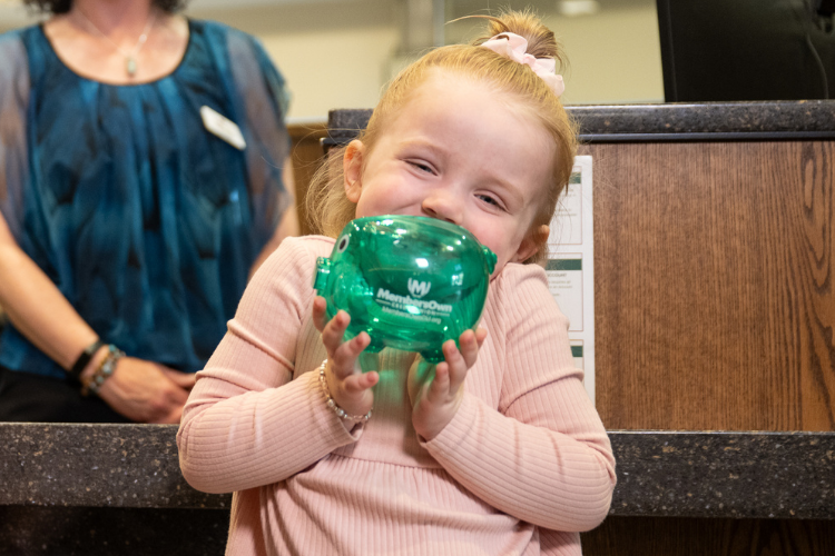 Girl with piggy bank